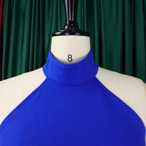 Detailed view of royal blue halter neck collar with fine textured fabric and clean seams