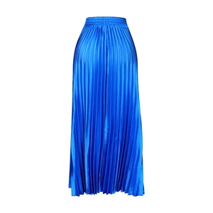 Close-up of elegant pleated satin maxi skirt featuring high waist and royal blue silk texture