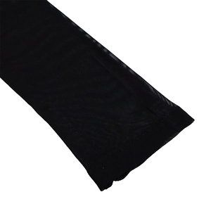 Close-up detail of sheer black honeycomb mesh fabric with reinforced stitching on edges