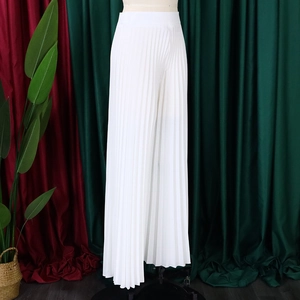 Detailed view of high waist pleated white wide leg trousers with a fluid vertical texture