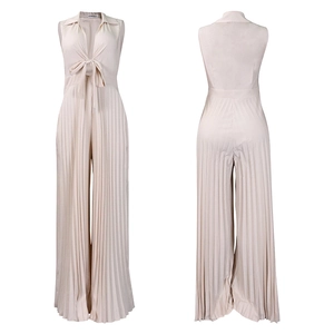 Detail of pleated champagne jumpsuit with V-neck collar and elegant bow tie tie design