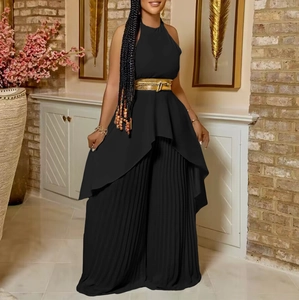 Elegant black halter top and pleated wide-leg pants set with a metallic gold belt