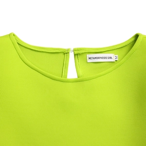 Detail of round neckline with keyhole back on lime green puff sleeve dress