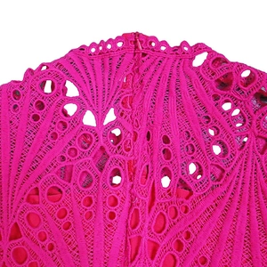 Detailed close-up of rose red lace fabric featuring back invisible zipper and hollow patterns