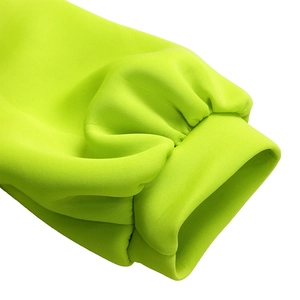 Close-up of neon green puff sleeve cuff showing premium fabric texture and stitching details