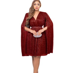 Detail of V-neck dark red pleated dress with cape design and sparkling belt