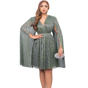 Detail of dark green V-neck cape sleeve evening dress with belted waist and pleated skirt