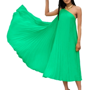 Detailed view of emerald green pleated fabric on an elegant one-shoulder maxi dress