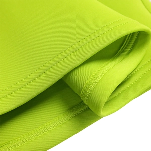 Close-up of neon green knit dress showing high-quality double-needle stitching and flat seams