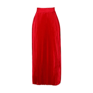 Detail view of the high-waisted elastic band and glossy pleated fabric of the red maxi skirt