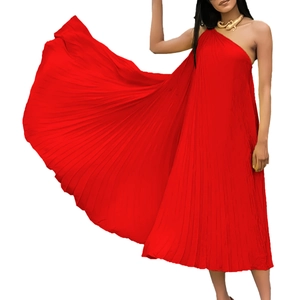 Detailed view of red pleated sleeveless dress with elegant asymmetrical slanted neckline