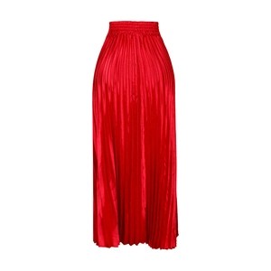 Detail of red pleated maxi skirt showing elastic high waist and glossy satin texture