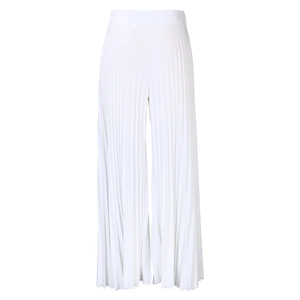 Detailed view of white pleated high-waisted wide-leg trousers with textured fabric finish