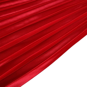 Detailed macro view of dark red pleated satin fabric with glossy metallic texture