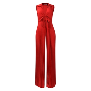 Detailed view of the red V-neck pleated wide-leg jumpsuit with a decorative waist bow