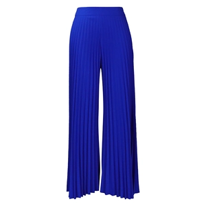 Detail of high-waist royal blue pleated wide-leg trousers with accordion texture