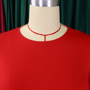Detailed view of the round neckline and smooth red fabric texture on a women dress