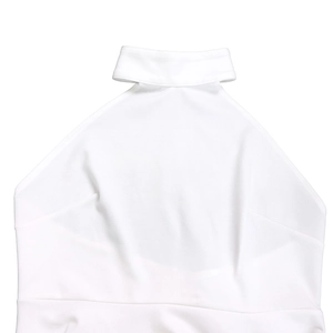 Detail of the high-neck halter top featuring a triangular cutout and smooth white fabric