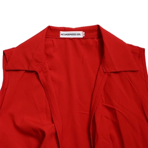 Detail of red V-neck jumpsuit collar with METAMORPHOSIS GIRL brand label size M