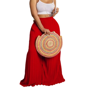Women's high waist red pleated wide leg pants with elegant textured flowing fabric
