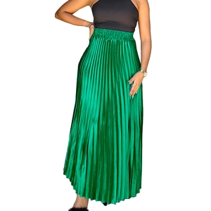 Detail of high waist pleated satin maxi skirt in bright green with elegant accordion folds