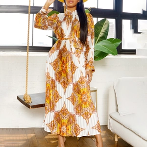 Detailed view of long-sleeve pleated maxi dress with orange paisley mandala print