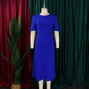 Detail of royal blue dress featuring elegant waist pleats and decorative gold buttons