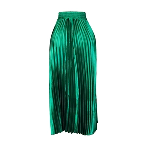 Macro shot of green pleated satin midi skirt showcasing metallic sheen and elastic waist