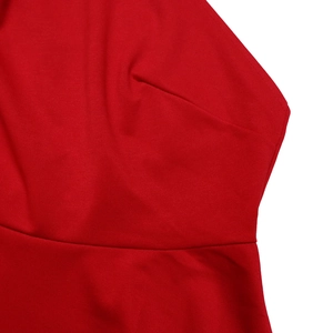 Detailed macro view of the premium red fabric texture and stitching of the summer set