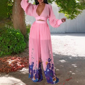 Detail of pink pleated V-neck top and floral wide-leg pants set for women