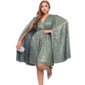 Detail of V-neck dark green pleated cape dress with metallic finish and waist belt