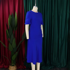Close-up of royal blue short sleeve dress showing pleated waist detail and round neckline
