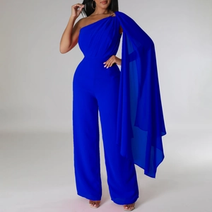 Detail of royal blue one-shoulder jumpsuit with flowing cape sleeve and wide-leg design
