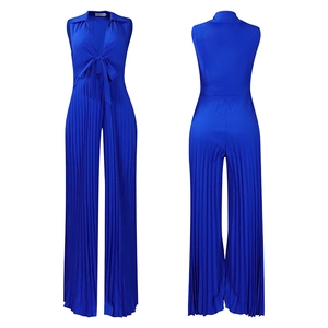 Detail of royal blue pleated wide-leg jumpsuit with deep V-neck and front tie design