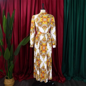 Detail view of the intricate mandala print and pleated texture on this long sleeve dress