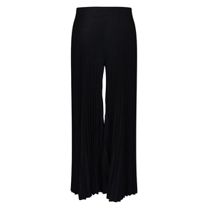 Detail of high-waist black pleated wide-leg trousers showing fabric texture and elastic waistband