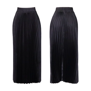Detail of elegant high-waisted black pleated maxi skirt with elastic waistband and satin finish