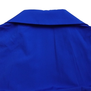 Close-up detail of the V-neck lapel and royal blue pleated woven fabric texture