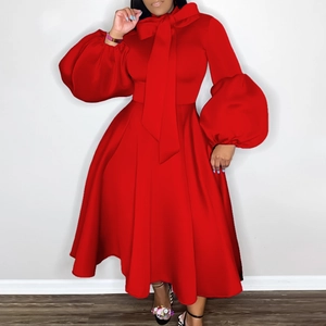 Detail of red lantern sleeves and oversized bow neckline on an A-line formal party dress