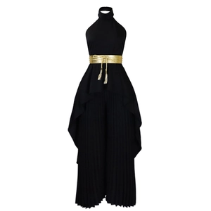 Detail of black halter pleated jumpsuit with wide-leg silhouette and gold waist belt