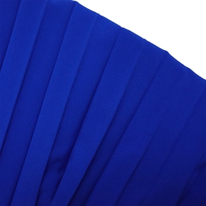 Macro shot of deep royal blue pleated fabric texture for elegant women's long jumpsuit