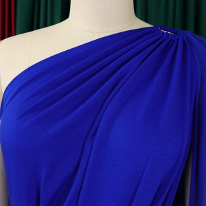 Detail of royal blue one-shoulder jumpsuit with pleated ruching and elegant drape