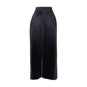 Detail of high waist black pleated maxi skirt in glossy satin fabric with elastic waistband