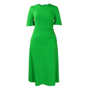 Detail of lime green dress featuring side pleats and decorative gold buttons
