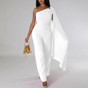 Detail of elegant white one-shoulder jumpsuit with flowing floor-length cape sleeve detail