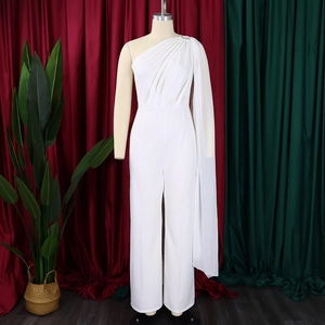 Close-up of elegant one-shoulder white jumpsuit with draped cape sleeve detail