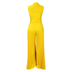 Detail view of the pleated fabric texture and wide-leg cut on back of yellow jumpsuit