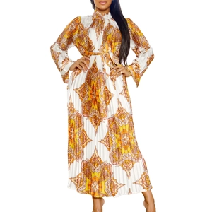 Close-up of pleated maxi dress with orange paisley prints and matching drawstring belt