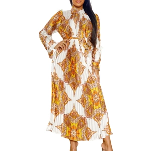 Detail of bohemian pleated maxi dress showing paisley print and ruffled high neck collar