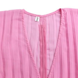 Detail of pink pleated V-neckline featuring a zipper closure and size S label